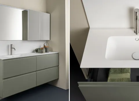 Modernes Badezimmer von Stocco mit grünem Doppelwaschtisch, Spiegelschrank und klaren Linien im puristischen Design.